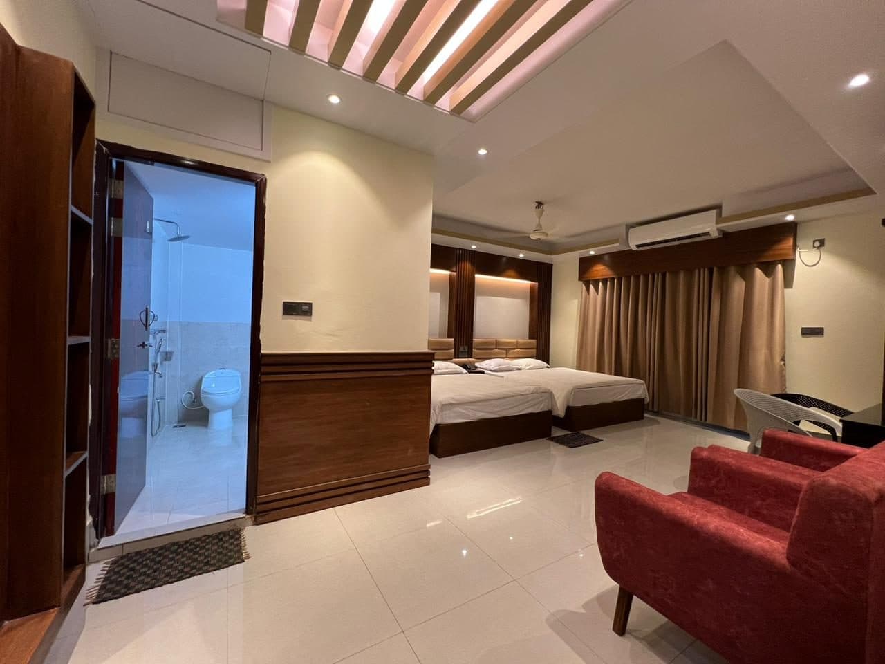 VIP suite with an open glass-walled bath