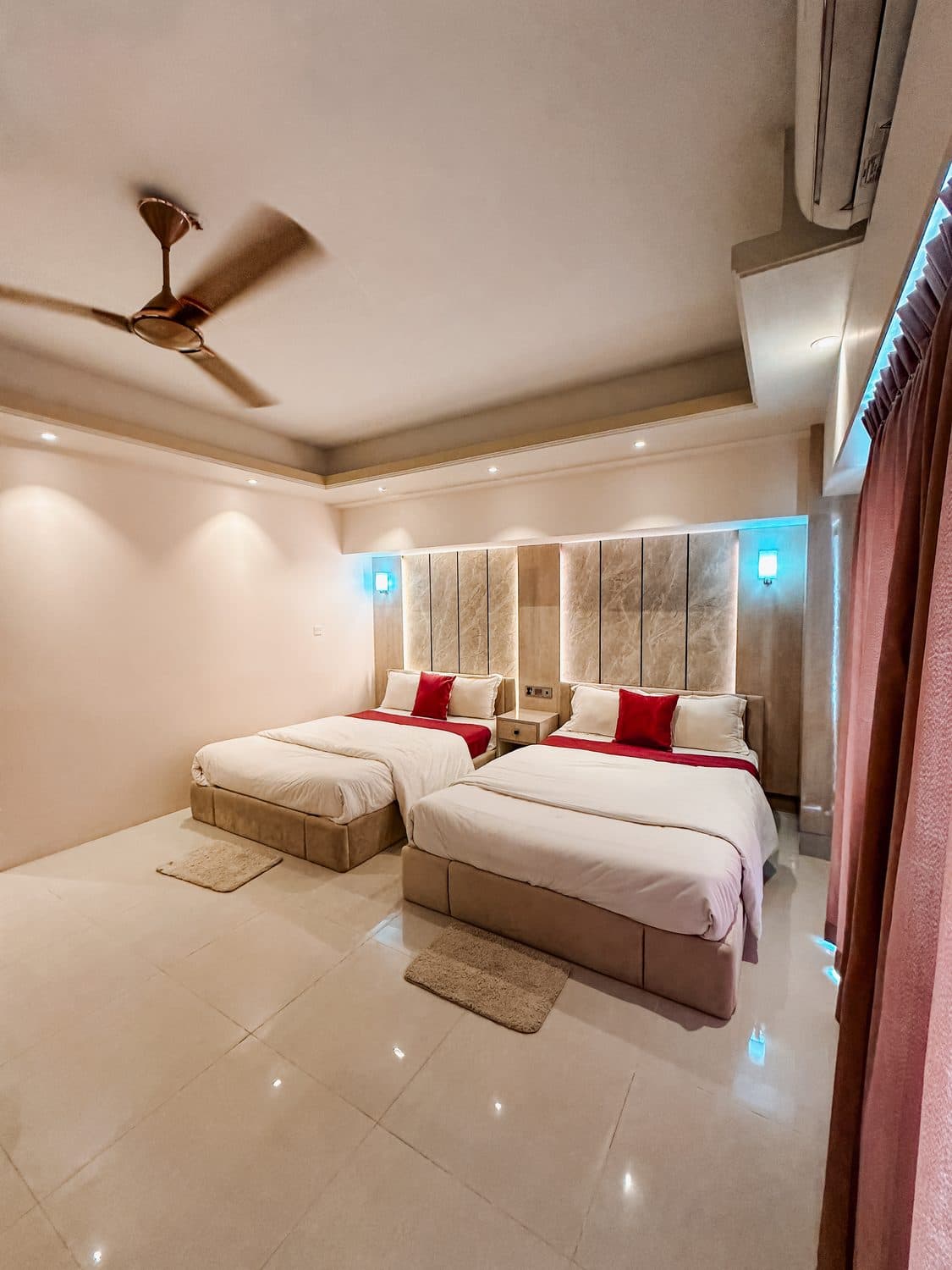 Family suite with twin beds and mood lighting